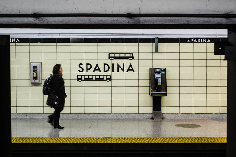 Woman on platform at TTC Station Spadina, Toronto, Canada