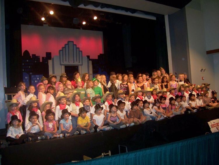 Elementary school children on stage for a talent show.
