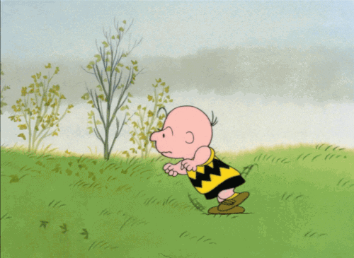 Peanuts cartoon gif:  Lucy, pulling the football away from Charlie Brown