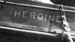 The word "heroine" on the side of a ship, cropped from a black and white image (credit at link), old-school font